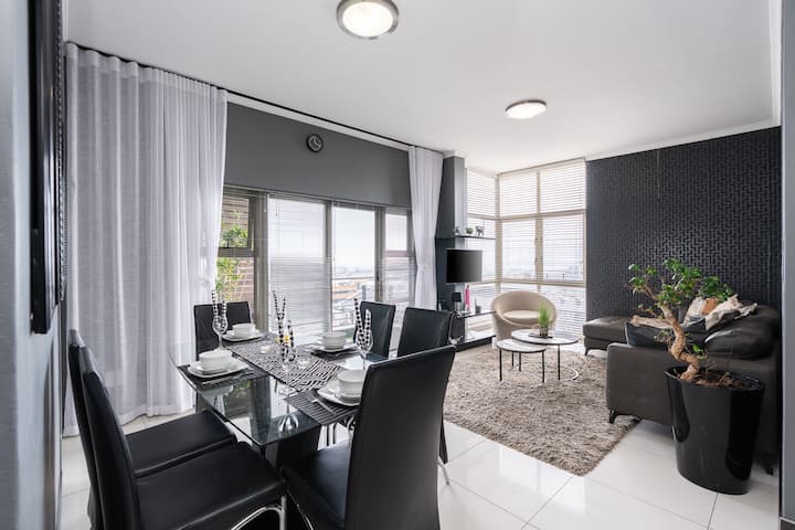 Dining Area: Dine in an elegant space featuring stunning views, creating the perfect setting for memorable meals and warm gatherings throughout your stay.
