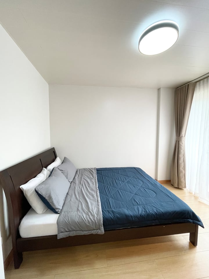 A comfy queen-size bed that can accommodate 2 adults and 1 child. Clean, spacious, and perfectly designed for couples or small families.