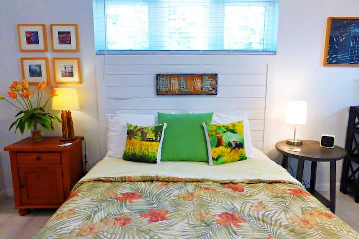 This inviting queen bedroom has a delightful vanity for primping without needing the bathroom.  A wicker high boy chest provides plenty of out-of-suitcase space for clothes but don't forget a large walk in closet for clothes and suitcases.