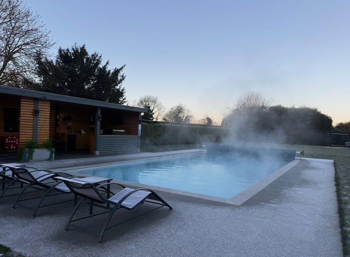 Heated pool on a winter evening