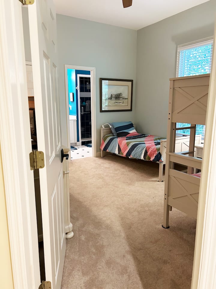 Three twin beds with ensuite Jack and Jill bathroom