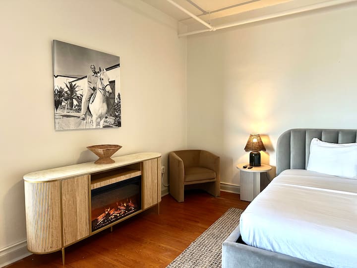 King Bedroom #1 with electric fireplace and incredible views of the mountains and lake. 