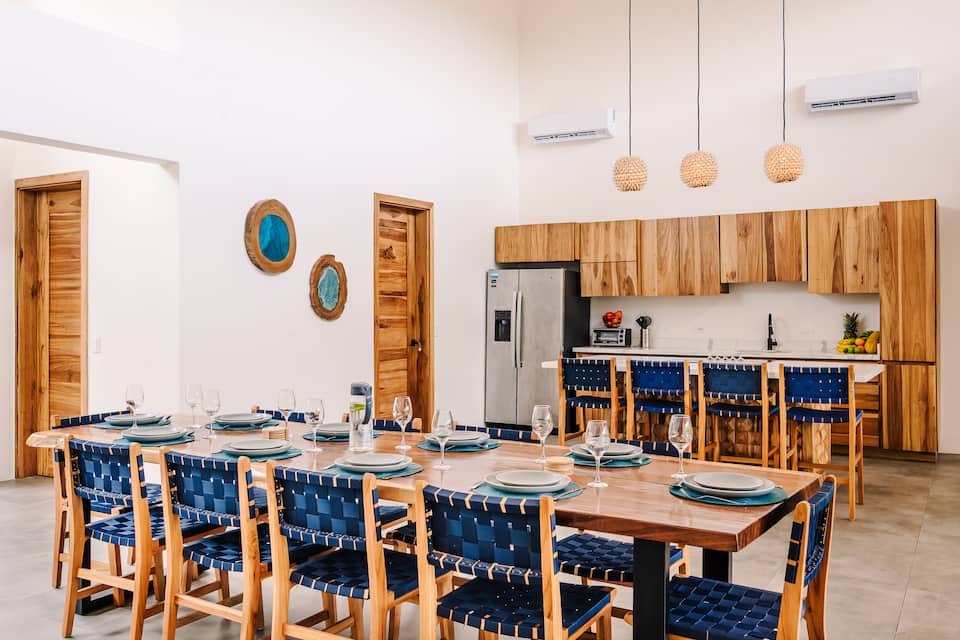A long table set for the whole group beside the kitchen