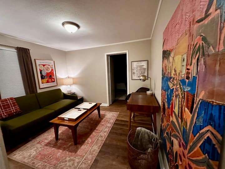 This open seating flex room serves as a fantastic workspace or visiting area that adjoins bedroom 2. The seating converts easily to a double bed. The extra bedding and a full size self inflating air mattress stored conveniently in the closet.