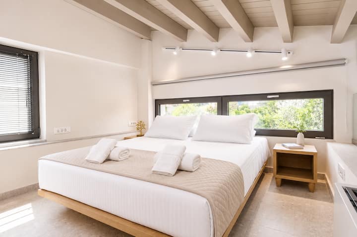 Attic Level - Bedroom 2 with queen bed, ensuite bathroom and balcony access