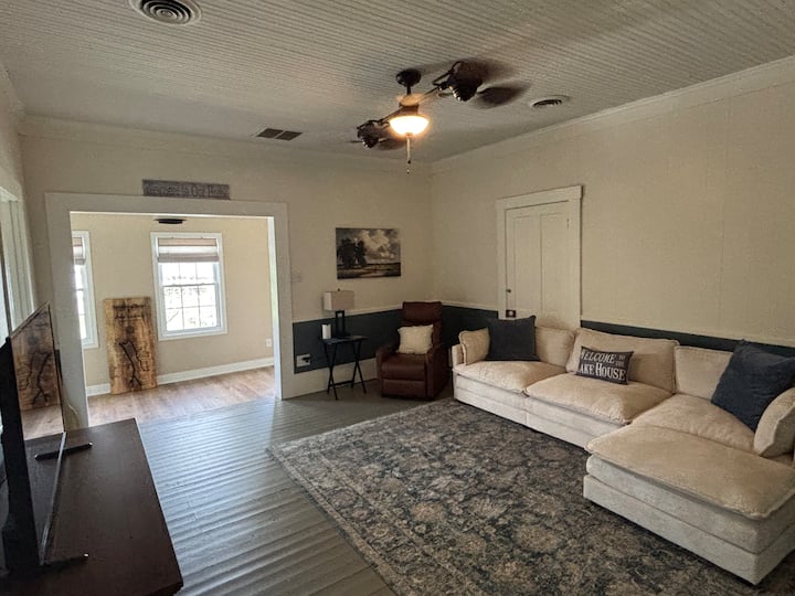 This is the upstairs living room. It is equipped with a 50” TV. 
