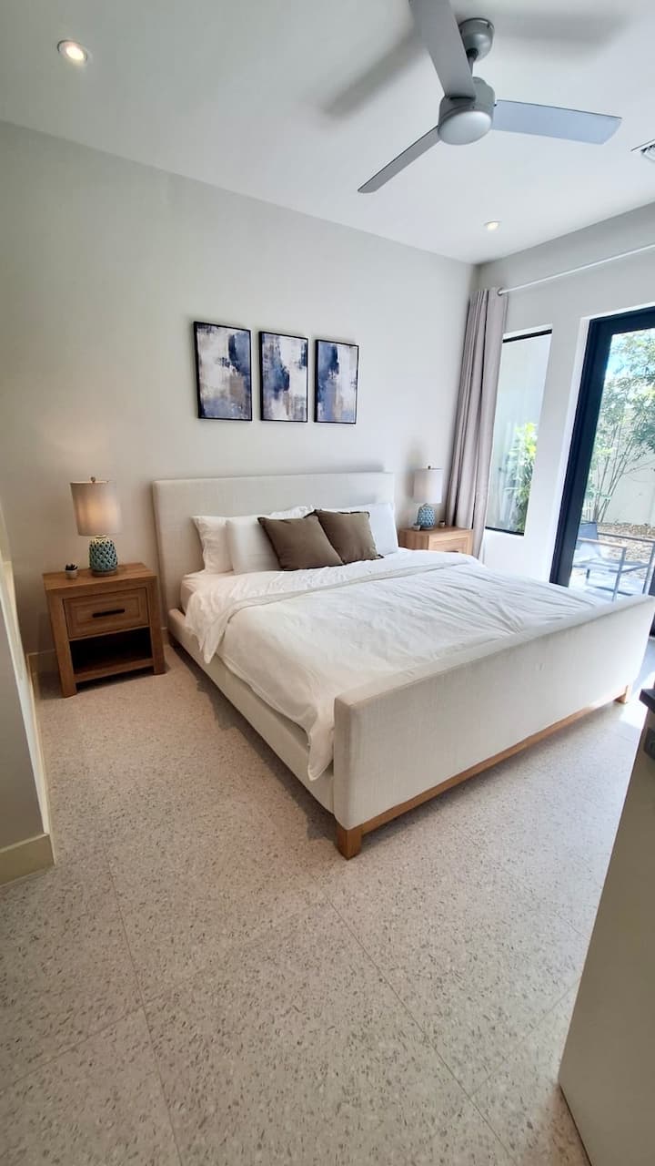 Step into this luxury master bedroom equipped with a comfortable Casper King bed, built in closet and cabinetry complete with drawers and hangers, and a walk-out to the patio. Plus enjoy access to a spacious ensuite master bathroom.