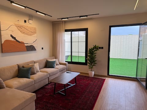 Elegant apartment with two bedrooms, outdoor seating and a beautiful atmosphere