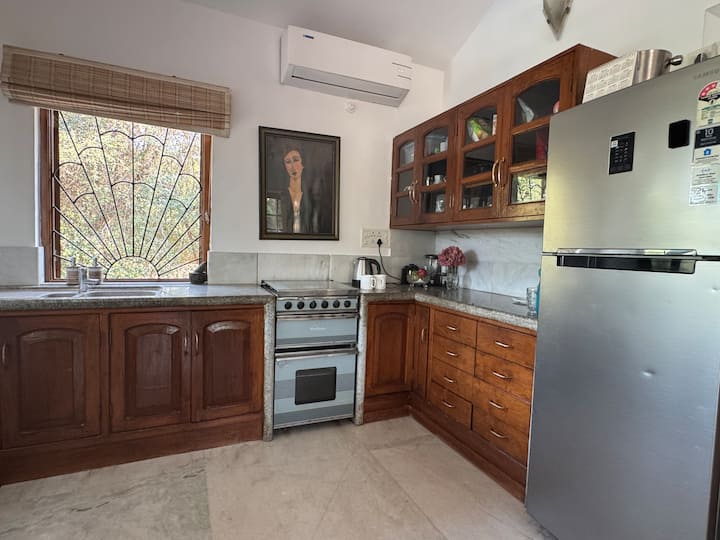 Kitchenette ,adjoining upstairs sitting room .Has cooker , large fridge freezer, food mixerelectric kettle