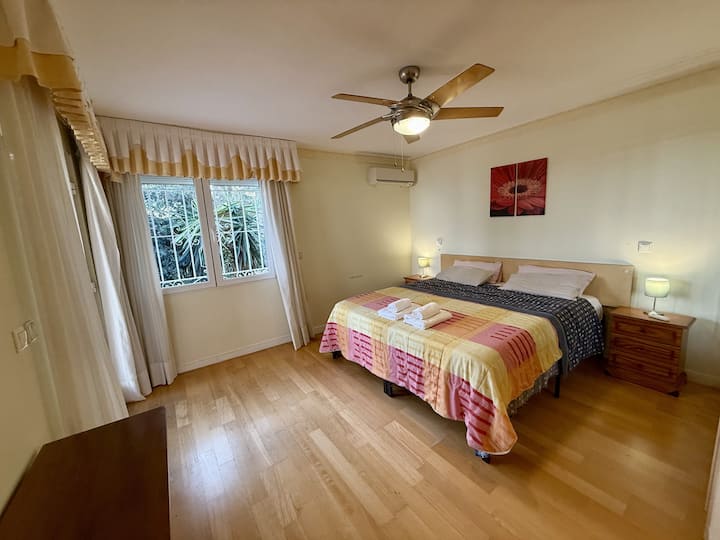 two twin beds put together to make a kind bed ; direct access to top terrace, sea views, garden and pool views ; own ensuite.
