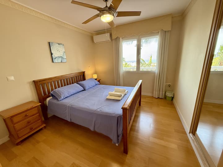 Queen bed, sea views, top level.