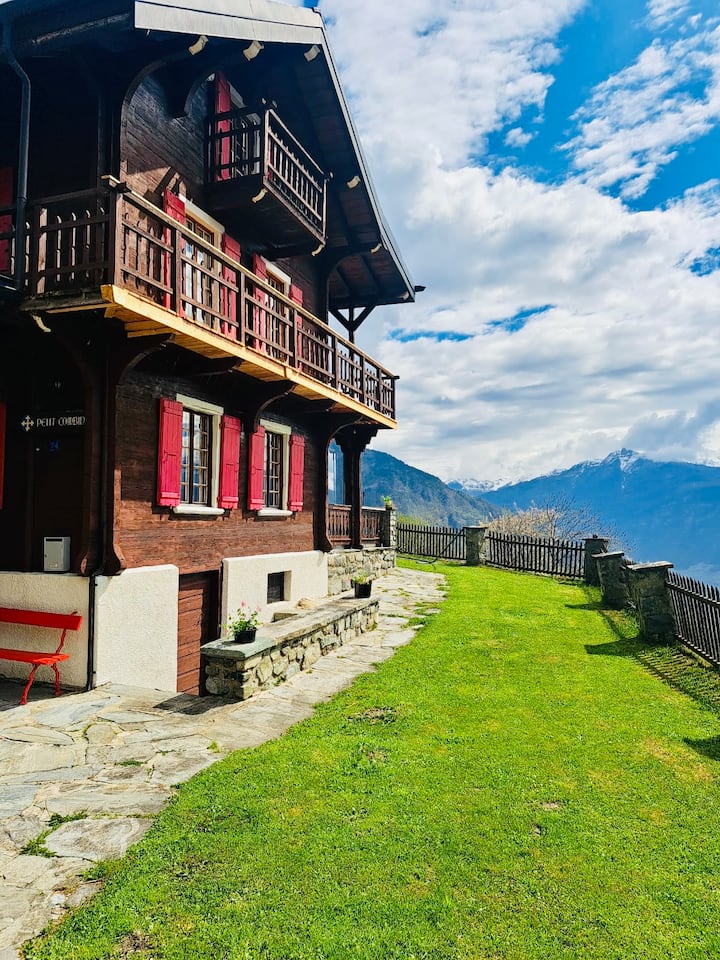 Typical chalet overlooking the Alps
