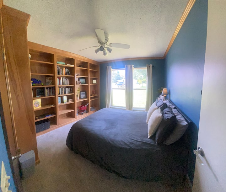 Queen Tempur-pedic with adjustable base so nice you might not want to get up. Shelves packed with vacation books and toys—a library playground! Or grab a book and run outside to the tree swing you can see from your window for the ultimate chill spot.