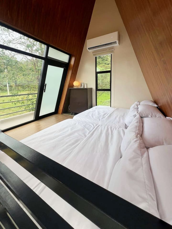 Cozy loft bedroom with plush bedding