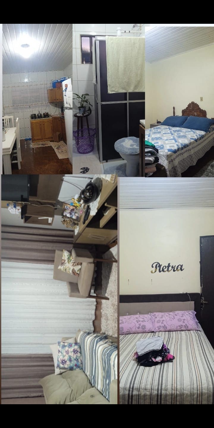 A shared space reveals various living areas, including a spacious sleeping area with a light-colored bedspread and decorative wall art. A comfortable seating area features neutral-toned furniture and colorful cushions. The kitchen is neatly arranged, with essential appliances and storage visible.