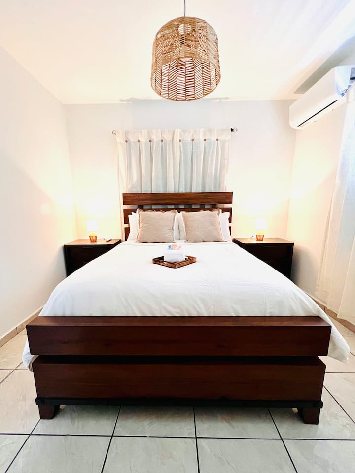 The ultimate retreat for the group leaders! Relax in the main house master bedroom, featuring a plush queen bed, fresh linens, and calming lighting for a well-deserved rest.