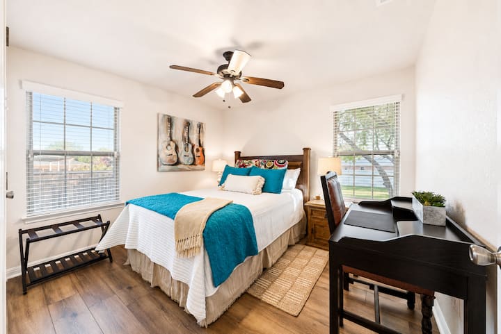 Bedroom 2 has a Queen bed & Shares a bathroom with Bedroom 3. Includes white noise machine and dedicated USB outlet for charging gadgets.