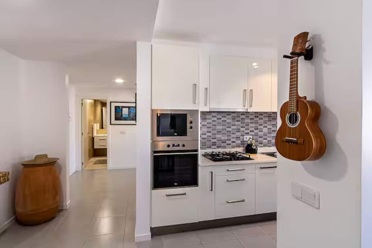 Kitchen appliances and preparation area at Mindelo Sunset