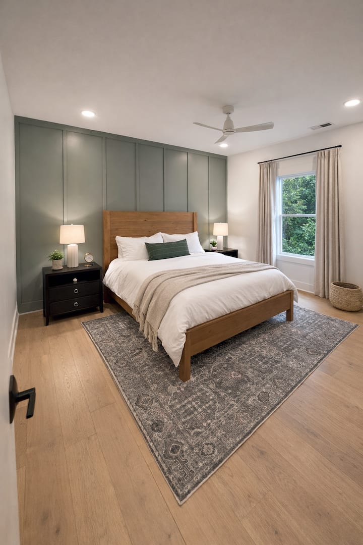 The primary king bedroom is located on the 1st level offering comfortable bedding, blackout shades, and a private en-suite bathroom.