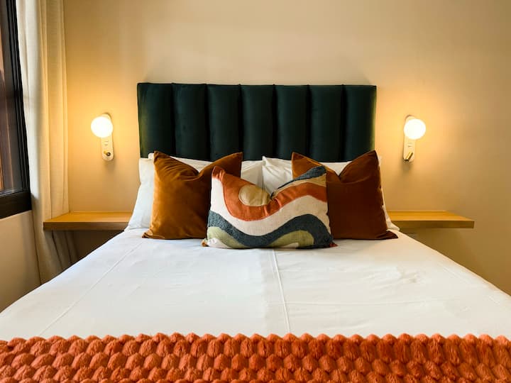 Master bedroom with double bed & on-suite bathroom. Offers ample cupboard space, ceiling fan, sound-stop windows and block out curtains