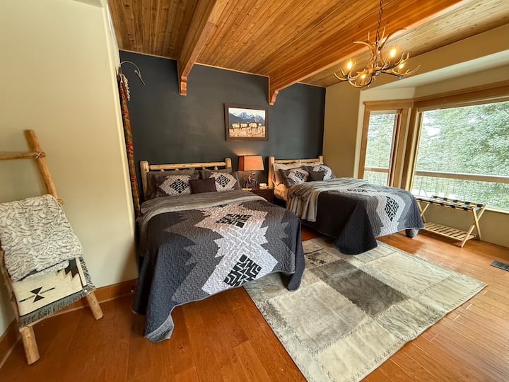 Bedroom 2 is located on the main level an is tastefully appointed in southwestern decor, it has two full size beds and is right across the hall from bathroom #2.