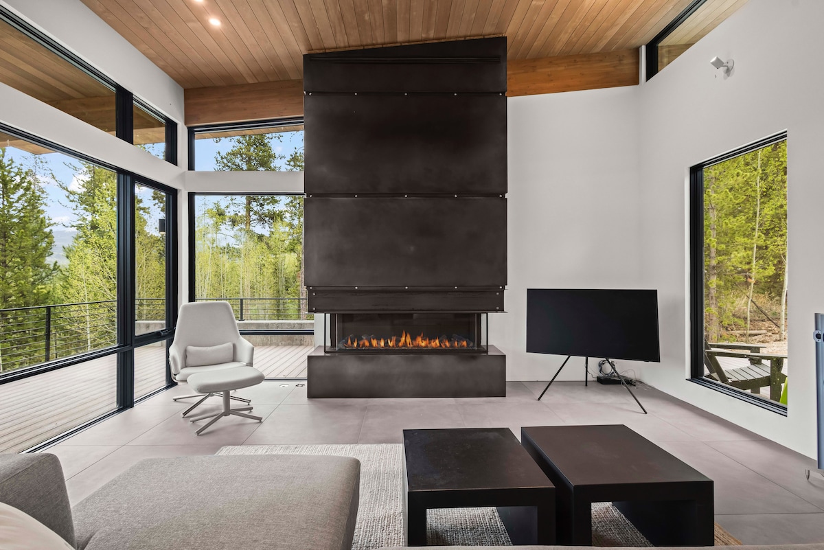 Dramatic steel cladded fireplace warms the room and your soul 