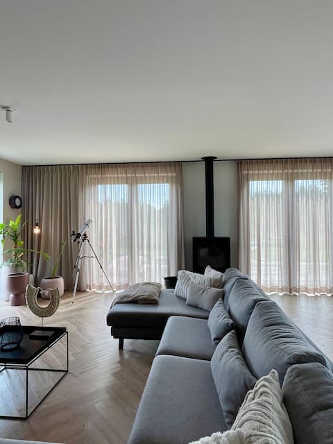 Popular Airbnb listing: Luxury vacation home on water, forest & large garden in Fryslân