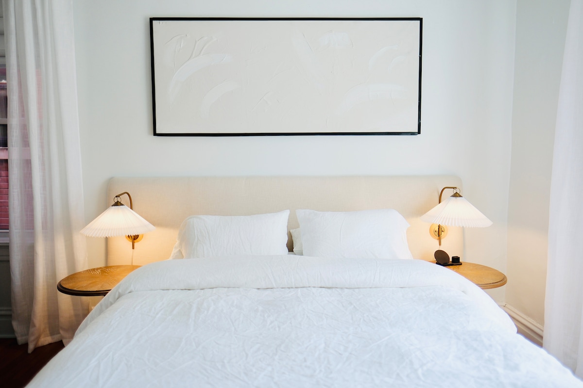 Master suite with Queen Bed and charging station.