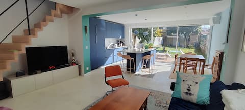 House near tram with garden