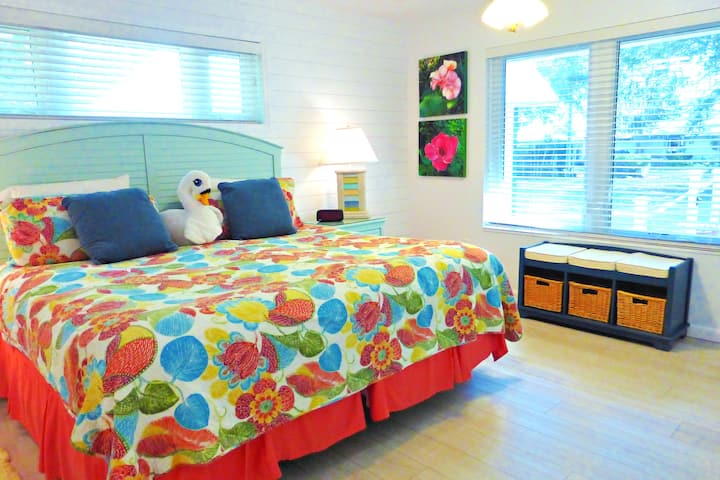 Twin beds in this Lily Pad cottage can be strapped together for a king.  A large walk-in closet allows space for hanging or for luggage storage. This is the slightly larger bedroom for those with mobility aids and easy access to the roll in shower.