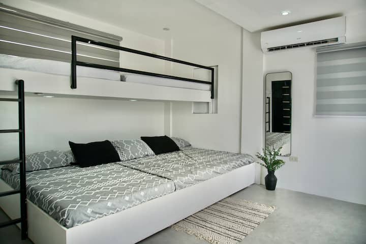 Our dorm room has a huge bunk bed and a custom-arranged floor mattress. This room can sleep up to 12 people.

With a private bathroom and access to the balcony