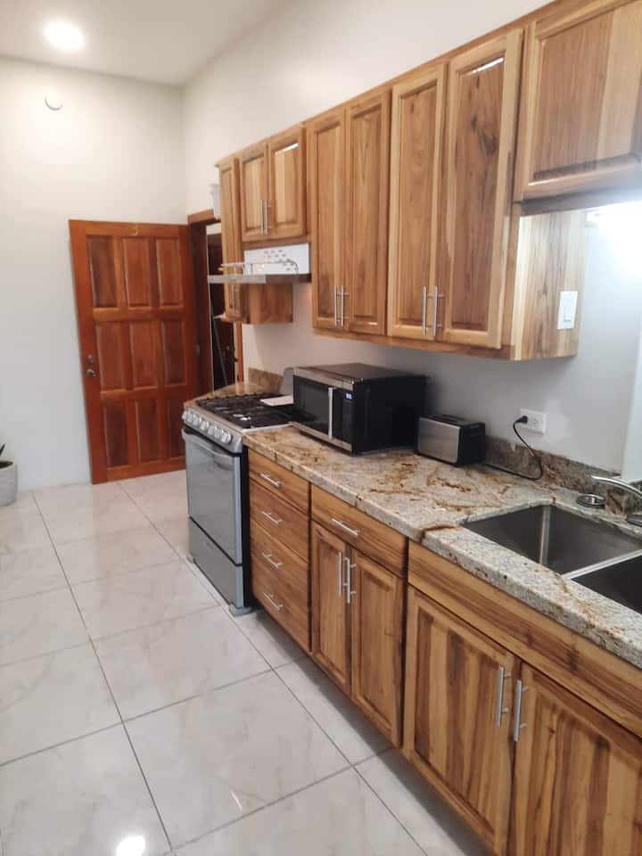 Lagoon-waterfront King Suite| Kitchen| Pool - Placencia