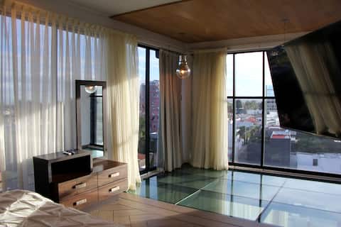 Penthouse with Glass Floor and Volcano View