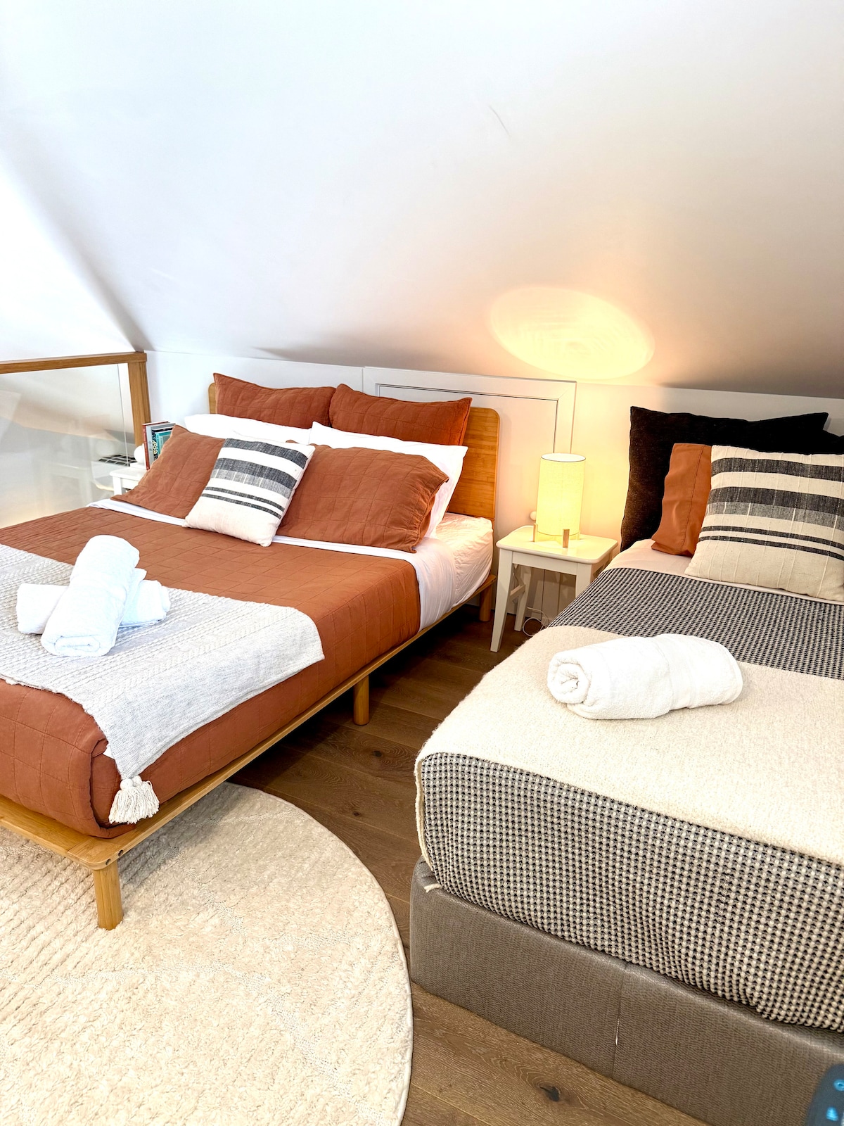 Loft bedroom features two beds 1x single and 1x queen for extra guests. An extra linen fee applies. 
