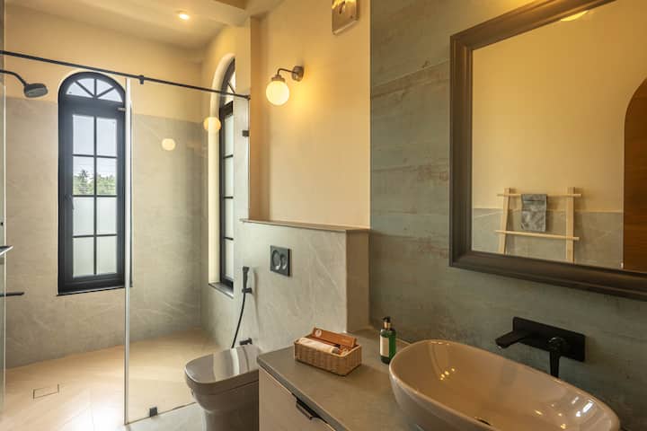 Our beautifully finished bathroom offers hot water, complimentary toiletries, and modern fixtures, ensuring a refreshing experience throughout your Goa vacation.