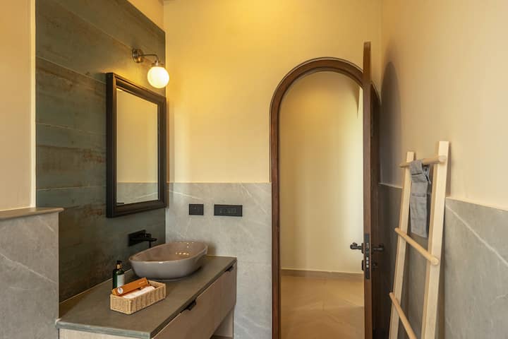 Start and end your day in a contemporary bathroom with 24/7 hot water, essential toiletries, and sophisticated finishes. Perfect for a luxury stay in North Goa.