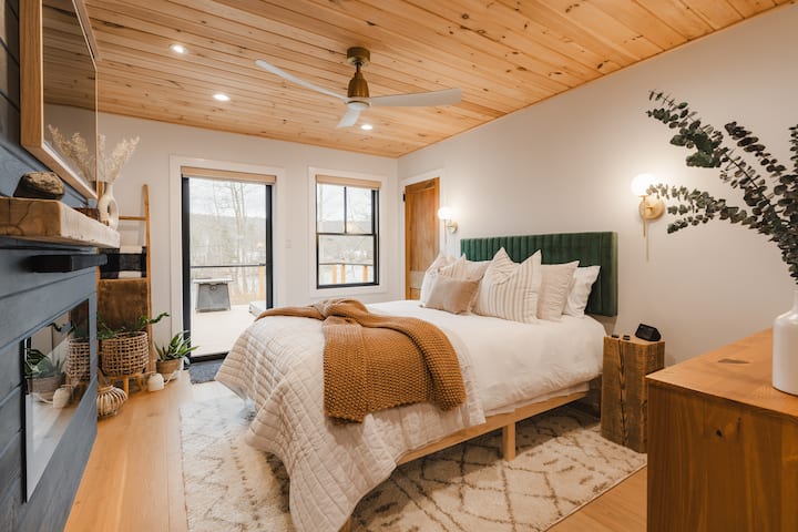 Cozy bedding and a comfortable bed make the primary bedroom the perfect place to unwind and rest.