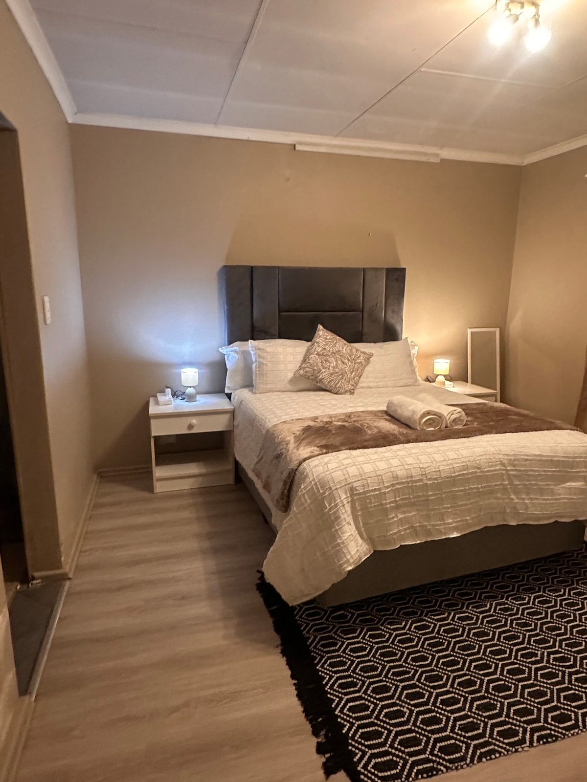 Sleep peacefully in the plush queen bed with soft linen and blackout curtains. Bedroom with en-suite bathroom 