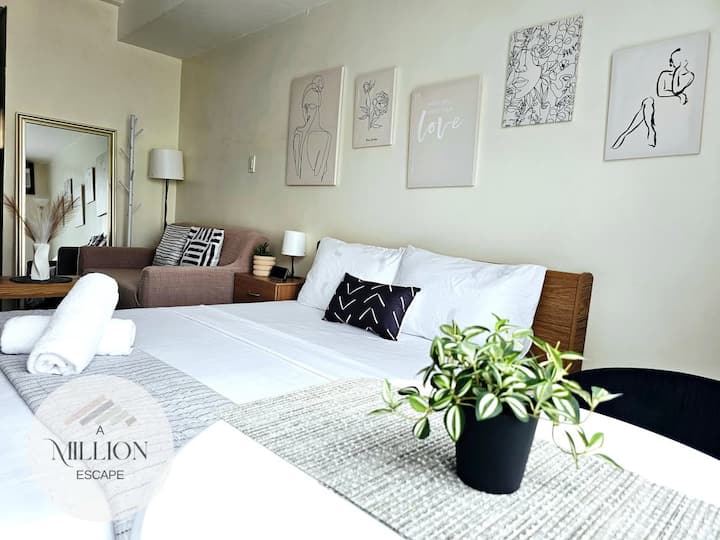 Stay productive and well-rested in this clean, quiet studio just minutes from BGC. The queen bed features crisp hotel-quality white linens and blackout-friendly ambiance, ensuring you get quality sleep before that big meeting.
