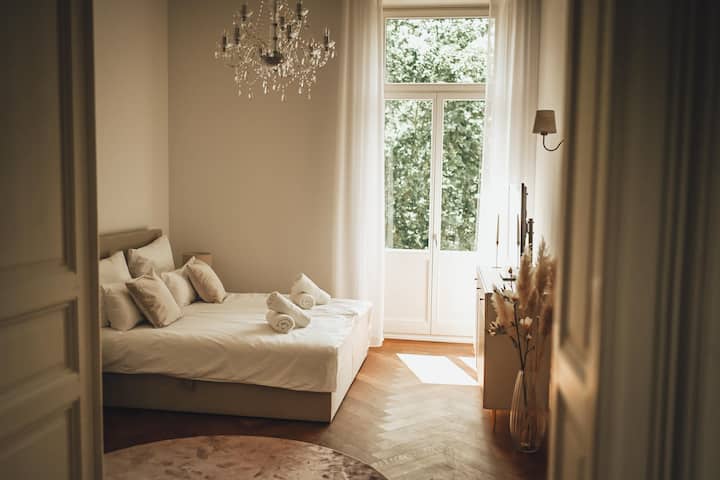 Another access to the balcony from the first bedroom.  This is equipped with a king size 1.80 x 2.00 m bed and a 48-inch smart TV for Netflix and Co.