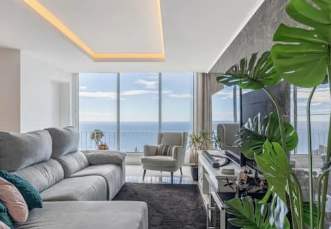Successful Airbnb property: Modern Ocean View+ Rooftop & Parking, near Funchal in Caniço