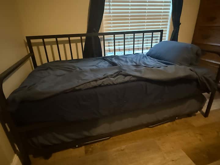 This is a trundle bed where it can be a extra twin for sleeping or open it up to make it a queen size