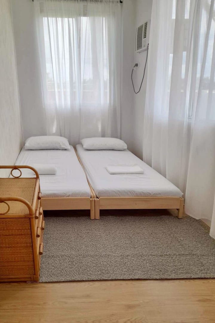 Our double-size bed offers a relaxing and restful experience. This bedroom comfortably fits 2 guests.