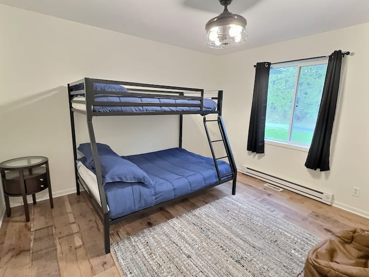 Spacious bunk room (double/full) with bean bag chairs and closet.