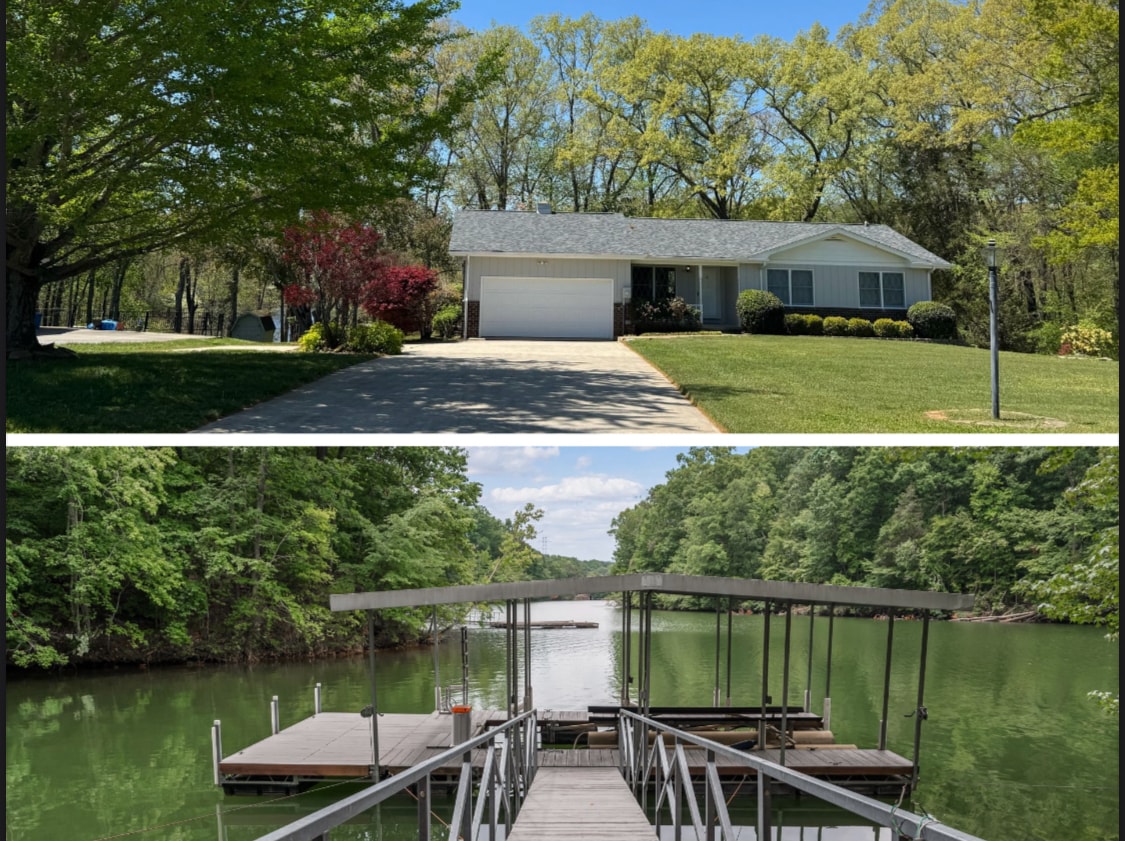 The image captures a charming lake house set amidst lush greenery, featuring a well-maintained front yard and a welcoming driveway. Below, a covered dock extends over tranquil waters, surrounded by verdant trees, inviting leisurely activities by the lake.