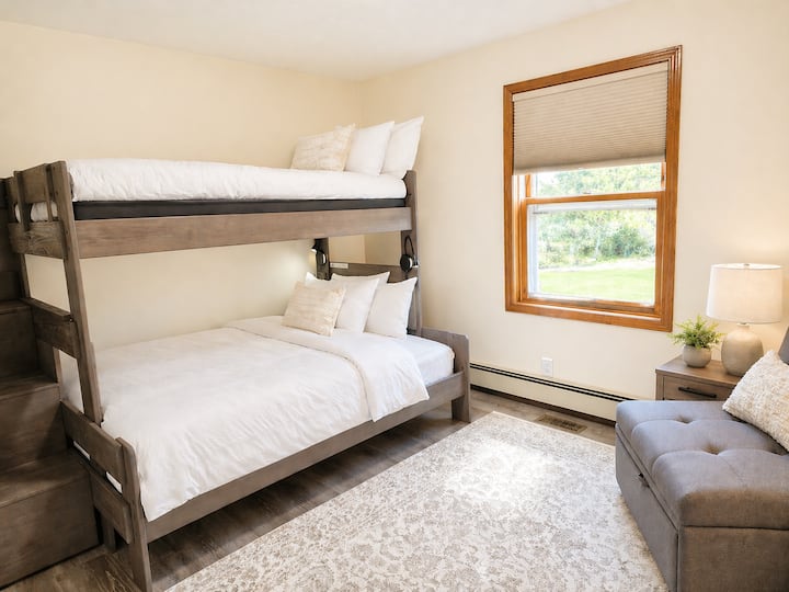 Flexible sleeping for your group: a twin over full bunk bed plus a chair that converts to a twin bed. Comfortable, space-smart, and thoughtfully designed. For safety, the top bunk is for guests ages 6 and up only.