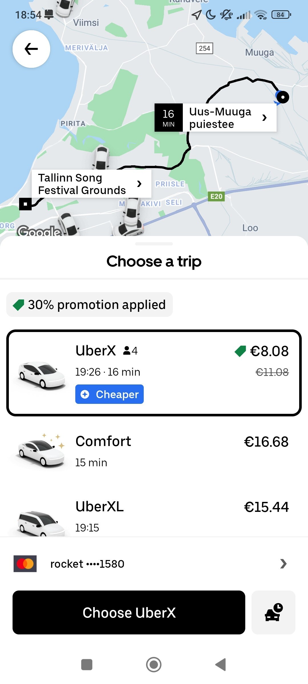 A screen displays a map with a marked route from Tallinn Song Festival Grounds. Nearby Uber options appear, including prices and estimated arrival times for different vehicle types. The interface showcases a clean layout with icons and a promotion indicator at the top.