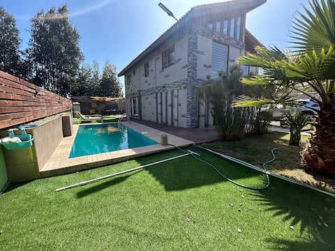 Large house with a beach pool.