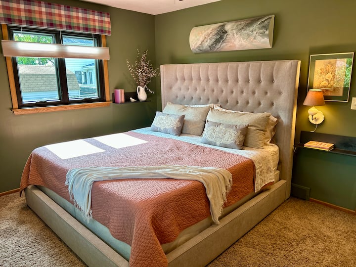The Evergreen Room
Spacious and serene, this primary bedroom features a plush king bed, calming green walls, and soft, layered textures—your restful retreat at Haven & Hearth.