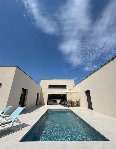 Contemporary villa: pool and scrubland